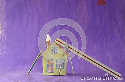 Construction and architecture concept.Residential building as cute model home and various tools, free copy space Stock Photo