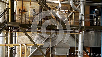 Construction of building interior of factory. Modern industrial building. Equipment and piping as found inside of Stock Photo