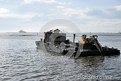 Construction bulldozer crane truck working, loaded on floating steel barge Editorial Stock Photo