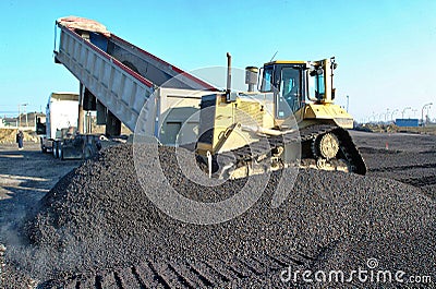 A construction bulldozer moving gravel Editorial Stock Photo