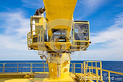 Construction cane at oil and gas well head remote platform. Stock Photo