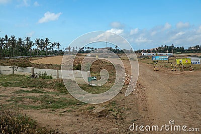 Construction of a complex on the Motogp Mandalika circuit, West Nusa Tenggara, Lombok, Indonesia. Banners with a plan of the area Editorial Stock Photo