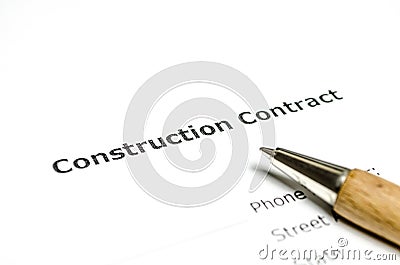 Construction contract with wooden pen Stock Photo