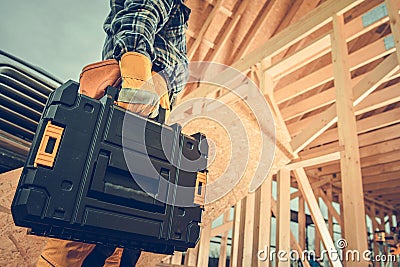 Construction Contractor with Plastic Power Tools Box in His Hand Stock Photo