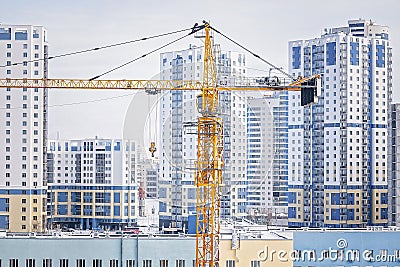 Construction crane build a new high-rise building. Commercial real estate and development Stock Photo