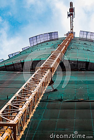 Construction crane near the building Stock Photo