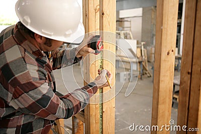 Construction Electrician Measuring Stock Photo