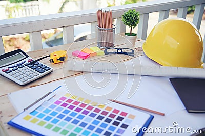 construction engineer office desk architect workplace. engineer drawing objects table with meter, blueprint, hard hat engineering Stock Photo