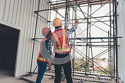 Construction engineer teamwork are inspection site constructing and installation steel scaffolding platform., Project manager and Stock Photo