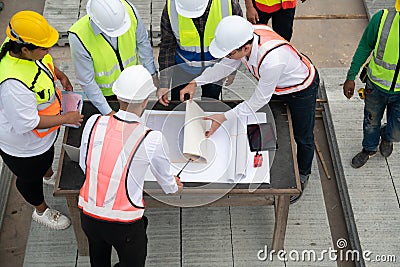Construction engineers, architects, and foremen form a group. Stock Photo
