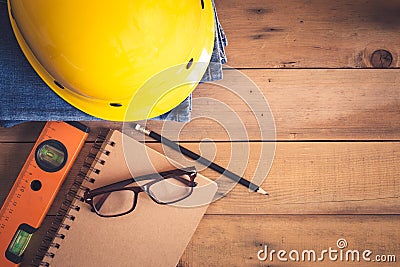 Construction equipment on old wood table Stock Photo