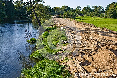 Construction of a floodbank or levee along a river Stock Photo