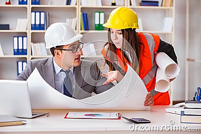 The construction foreman supervisor reviewing drawings Stock Photo