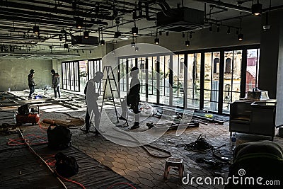 Construction industry workers working inside modern building site in vietnam Editorial Stock Photo