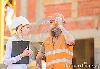 Construction inspection, corrections and fines. Safety inspector concept. Discuss progress project. Inspector and Stock Photo