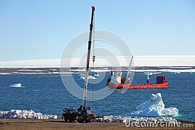 Construction machinery and ship in Arctic Stock Photo