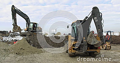 Construction Machinery At Work On Building A House. Different Types Of Tractors And Excavators Prepare The Soil For Editorial Stock Photo