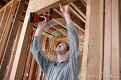 Construction Man Using Drill Stock Photo