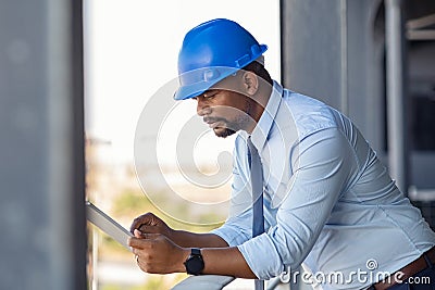 Construction manager using digital tablet Stock Photo