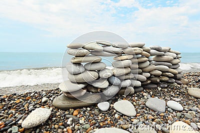 Construction of many pebbles on a sea coast Stock Photo