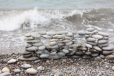 Construction of many pebbles on a sea coast Stock Photo