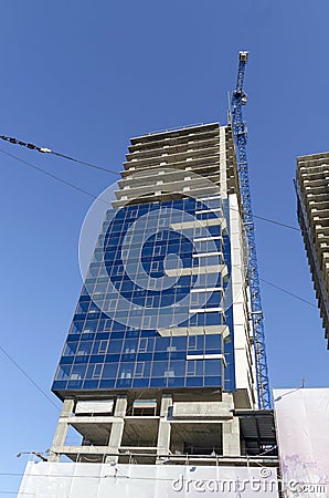 Construction of many storeyed building in different readiness Stock Photo