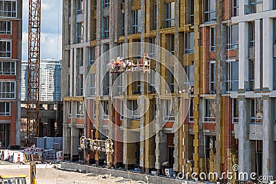 Construction of modern high-rise buildings. New residential complexes. The concept of urban development Editorial Stock Photo