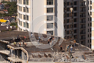 The construction of a multi-storey modern house on the seashore. Installation of floor reinforcement. Tower cranes. September 9, Editorial Stock Photo