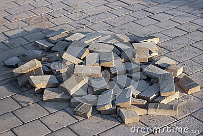 Construction pavement stones and bricks on terrace, road or sidewalk on the city street. Stock Photo