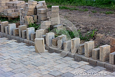 Construction pavement stones and bricks on terrace, road or sidewalk on the city street. Stock Photo