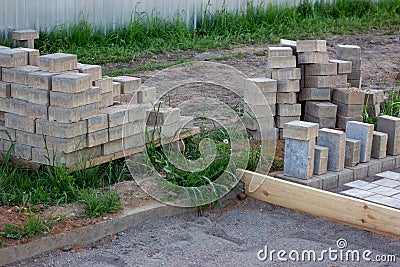 Construction pavement stones and bricks on terrace, road or sidewalk on the city street. Stock Photo