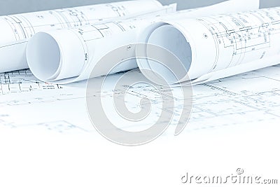 Construction plan in progress and blueprint rolls on architect w Stock Photo