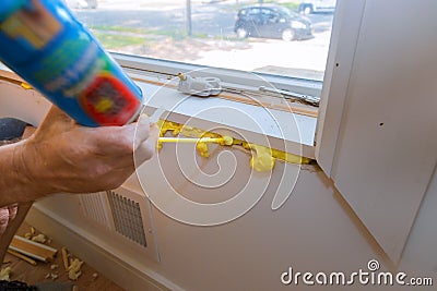 Construction PU foam in the window installed using a mounting installation foam Stock Photo