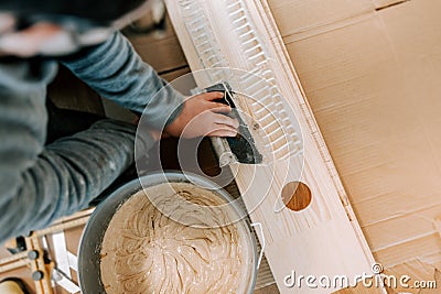 Construction of a renovated apartment. installation of wooden floors with hardwood parquet Stock Photo