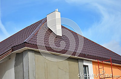 Construction or repair of the rural house with, eaves, windows, chimney, roofing, fixing facade, insulation, plastering Stock Photo