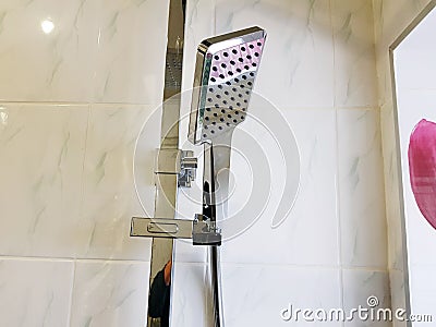 Construction and repair - shower in the bathroom on a chrome pipe Stock Photo