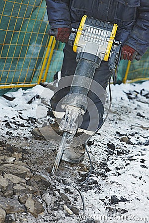 Construction road works with jack hammer Stock Photo