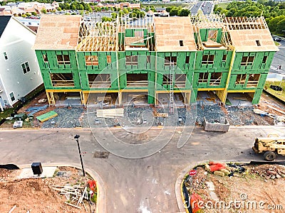 Construction of a roof on a new three-storey wooden building. Construction site in a small American town Editorial Stock Photo