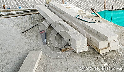 construction saw tool put on cement floor in can at house site. prepare equipment for install wall white brick Stock Photo