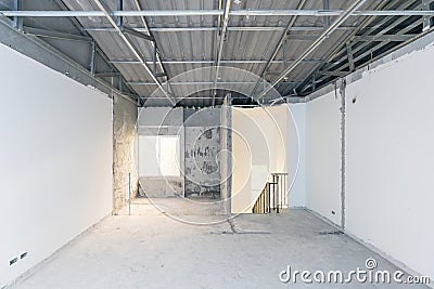 Construction site of empty Interior space, unfinished building after demolition process. Home improvement and renovation business Stock Photo