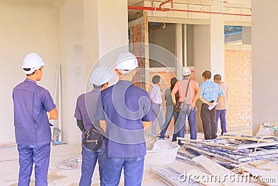 Construction site and engineer check build plan development on housing High rise building Editorial Stock Photo