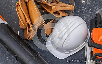 Construction Site Hard Hat and a Tools Belt Stock Photo