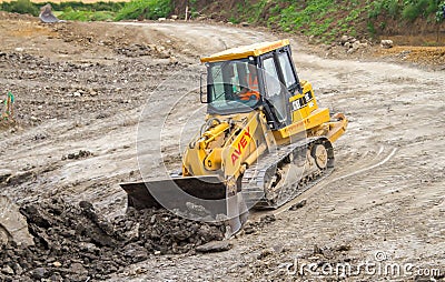 Construction Site with heavy excavating machinery Editorial Stock Photo