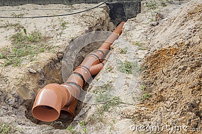 Construction site - orange waste pipe Stock Photo