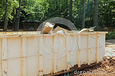 Construction site a rubbish removal metal container on recycle garbage, a trash dumpster is used Stock Photo