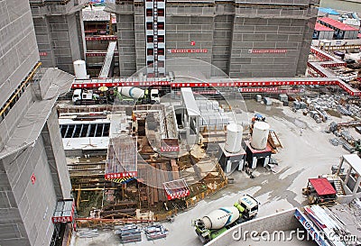 Construction site in Shanghai, China with cement mixers, scaffolding, building materials Editorial Stock Photo