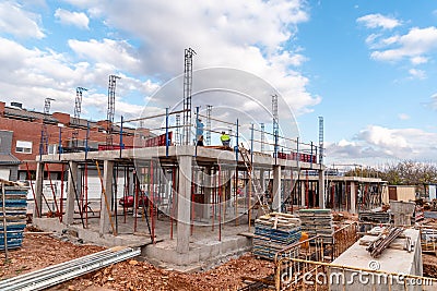 Construction site with steel formworks and reinforcing bars for pillars ready for concrete Stock Photo