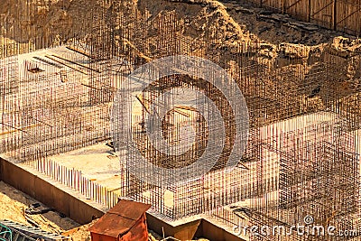 The construction site, top view. Enforced concrete steel frames rising up. The finished foundation of a building. Stock Photo