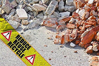 Construction solid waste management in building activity - concept image with text Reduce Reuse Recycle written on a yellow stripe Stock Photo