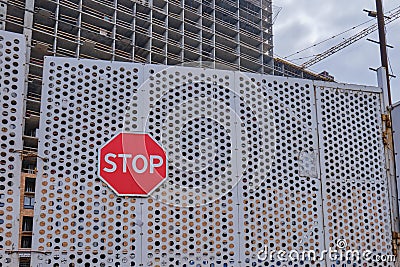Construction stopped due to coronavirus and quarantine epidemic. Gates with a stop sign on the construction site Stock Photo